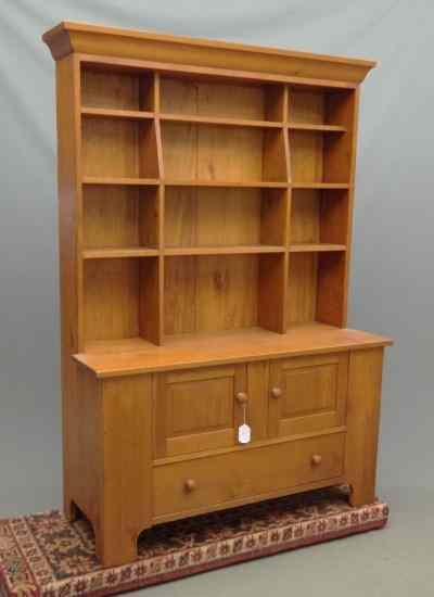 Appraisal: Contemporary pine cupboard having cubby shelves on top base with