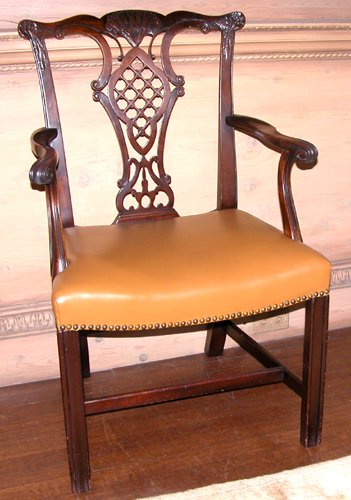 Appraisal: Title Carved Mahogany Chippendale-style Open Armchair with leather seat molded