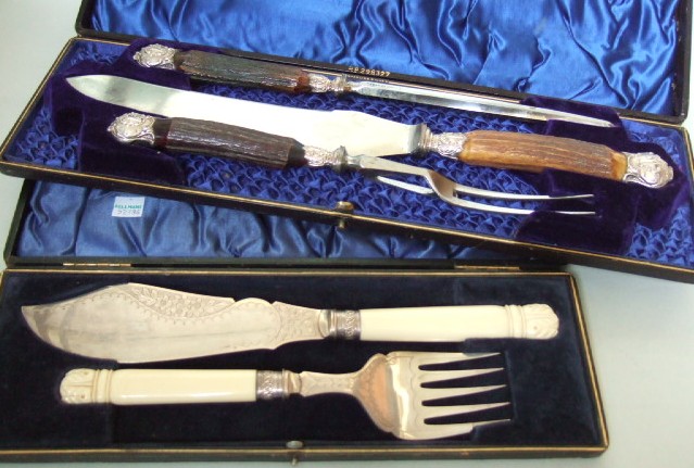 Appraisal: A late Victorian three piece carving set with silver mounted