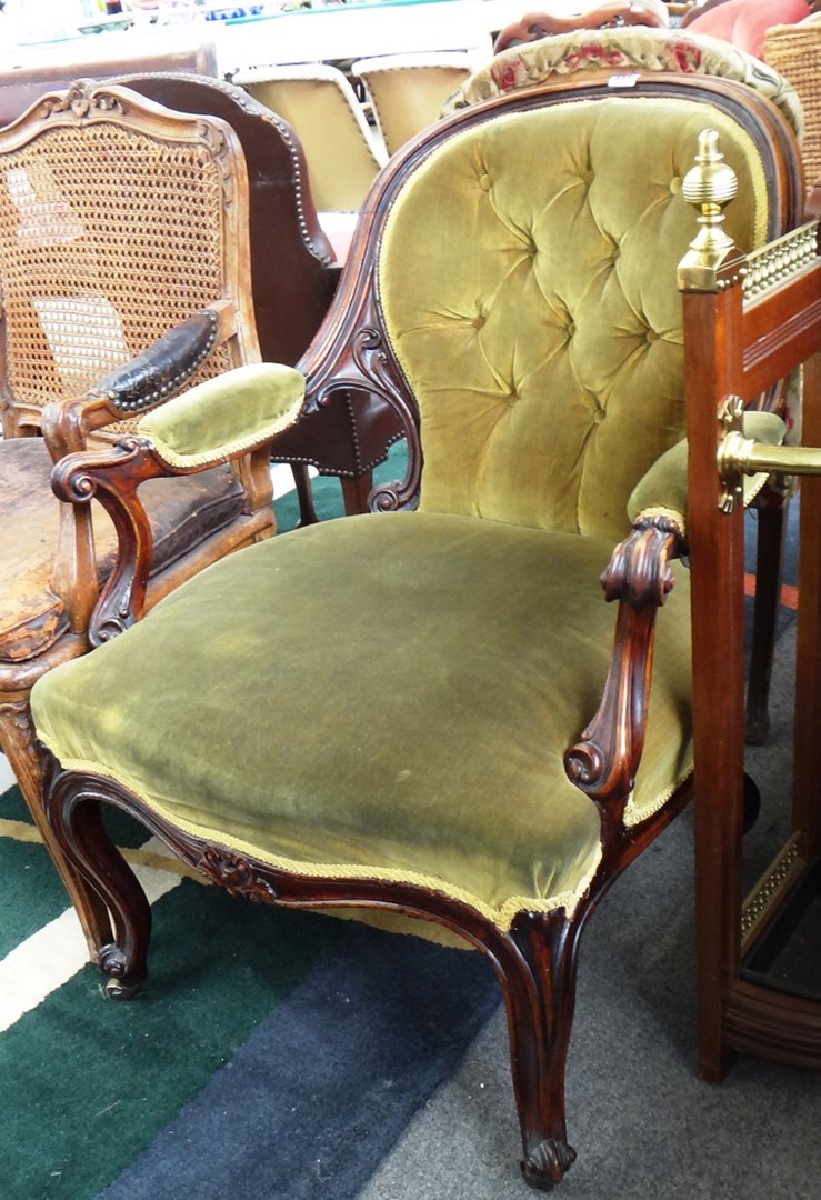 Appraisal: A Victorian walnut framed semi padded open armchair with serpentine