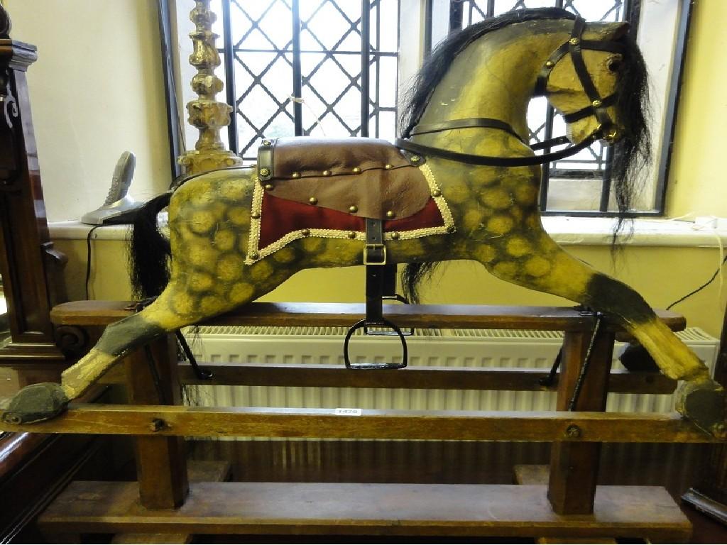 Appraisal: A small Edwardian dapple grey rocking horse with refurbished saddlery