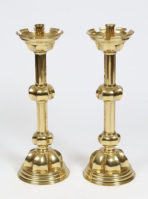 Appraisal: A PAIR OF LARGE BRASS CANDLESTICKS in the Gothic revival