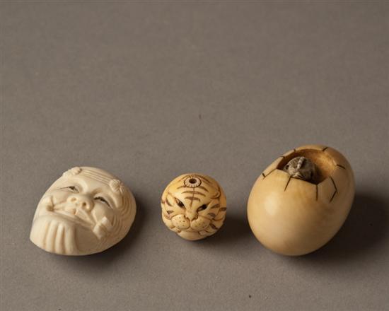 Appraisal: Two Ivory Netsuke and an Ivory Ojime one netsuke in