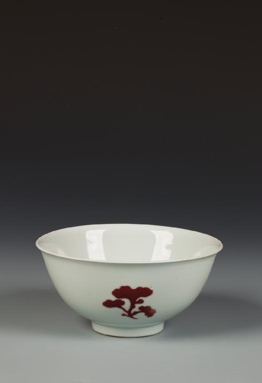 Appraisal: A CHINESE COPPER-RED AND WHITE BOWL with a U -shaped