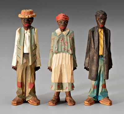 Appraisal: Three painted wood carvings chip carved and painted two African-American