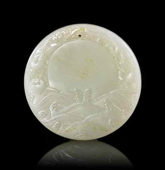 Appraisal: A Chinese Circular Toggle of pale celadon color stone having