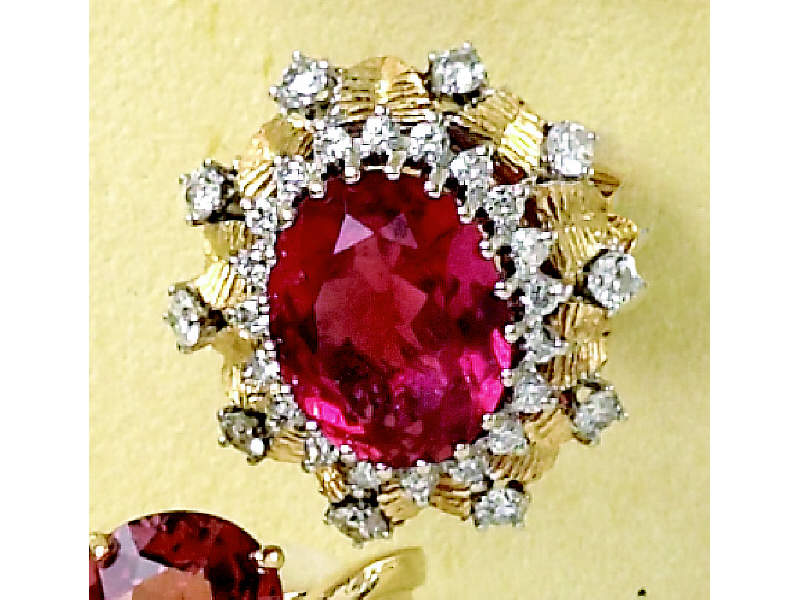 Appraisal: PINK TOURMALINE AND DIAMOND RING Yellow gold oval ring centering