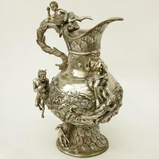 Appraisal: Modern Silvered Bronze Ewer with Raised Relief Unsigned Rubbing to