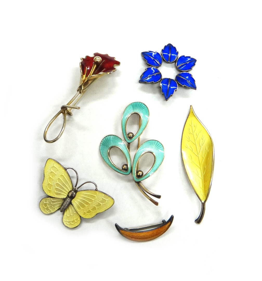 Appraisal: A group of five Scandinavian silver and enamel brooches comprising