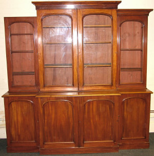 Appraisal: A Victorian mahogany breakfront bookcase circa the moulded cornice above