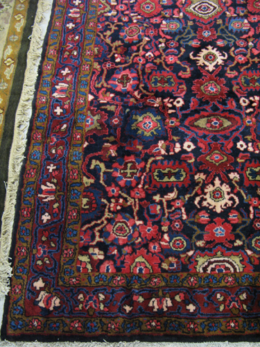 Appraisal: PERSIAN CARPET overall floral decoration on royal blue ground hand