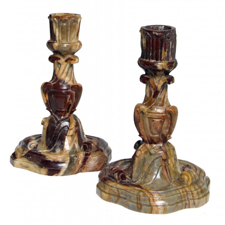 Appraisal: A PAIR OF CONTINENTAL CARVED BRECCIA MARBLE CANDLESTICKS in Baroque