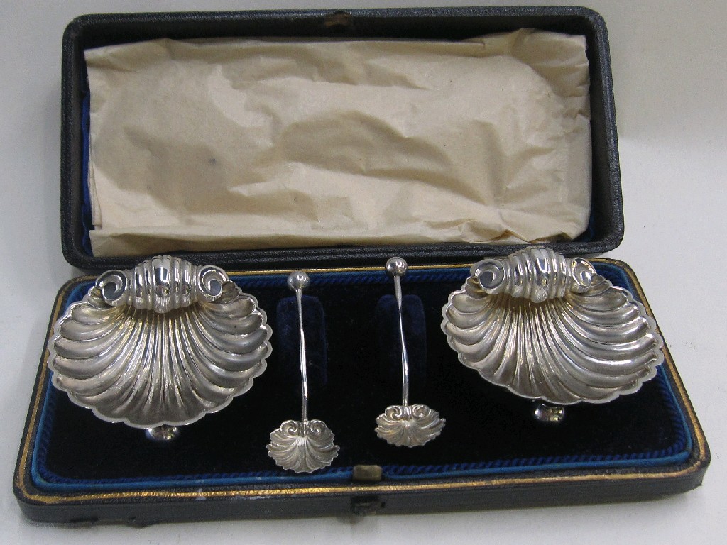 Appraisal: Cased pair of silver shell shaped salts with servers Birmingham