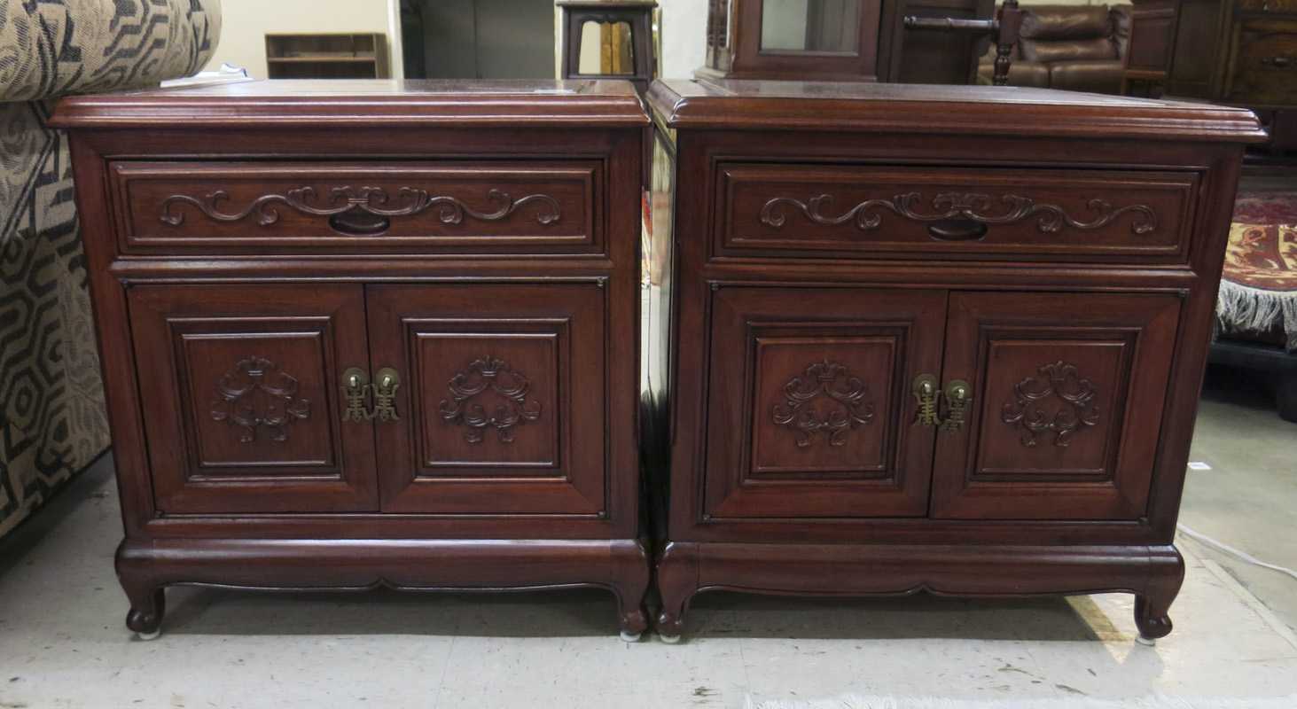 Appraisal: A PAIR OF CARVED ROSEWOOD CABINET END TABLES Chinese th