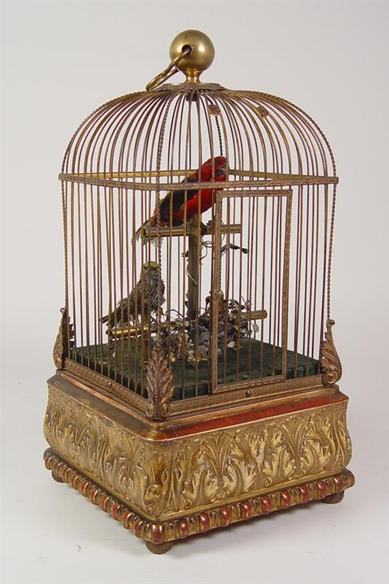 Appraisal: Singing Bird Cage with Two Birds Circa late 's Wood