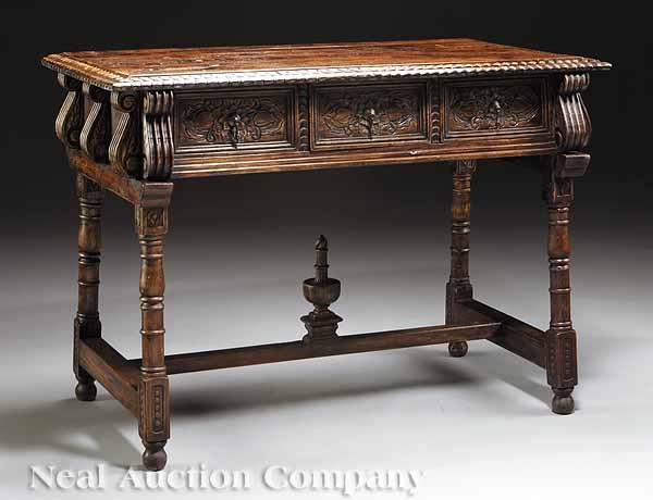 Appraisal: A Carved Elm Side Table in the Renaissance style fitted