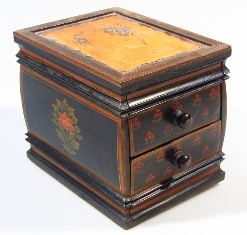 Appraisal: A painted wooden jewellery casket the rectangular carved top stamped