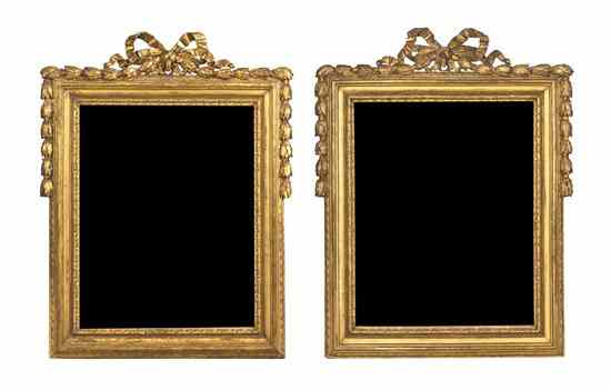 Appraisal: A Pair of Neoclassical Giltwood Wall Mirrors having a ribbon-tied