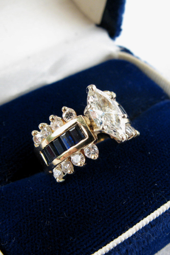 Appraisal: DIAMOND SAPPHIRE AND FOURTEEN KARAT GOLD RING Centered prong set