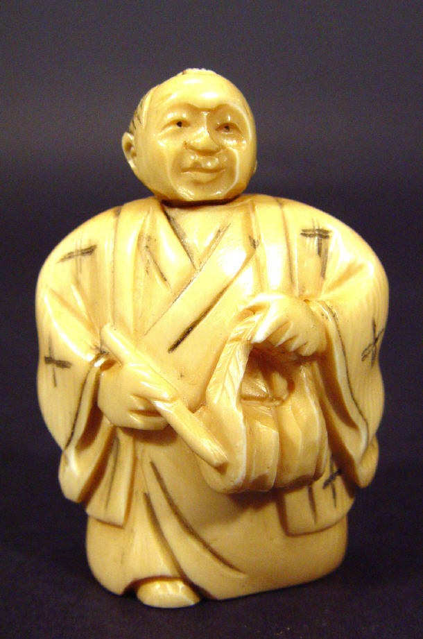 Appraisal: Oriental ivory Netsuke in the form of an elder with