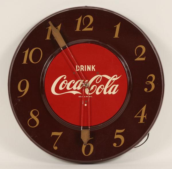 Appraisal: Coca Cola enameled s metal clock with trademark advertising dia