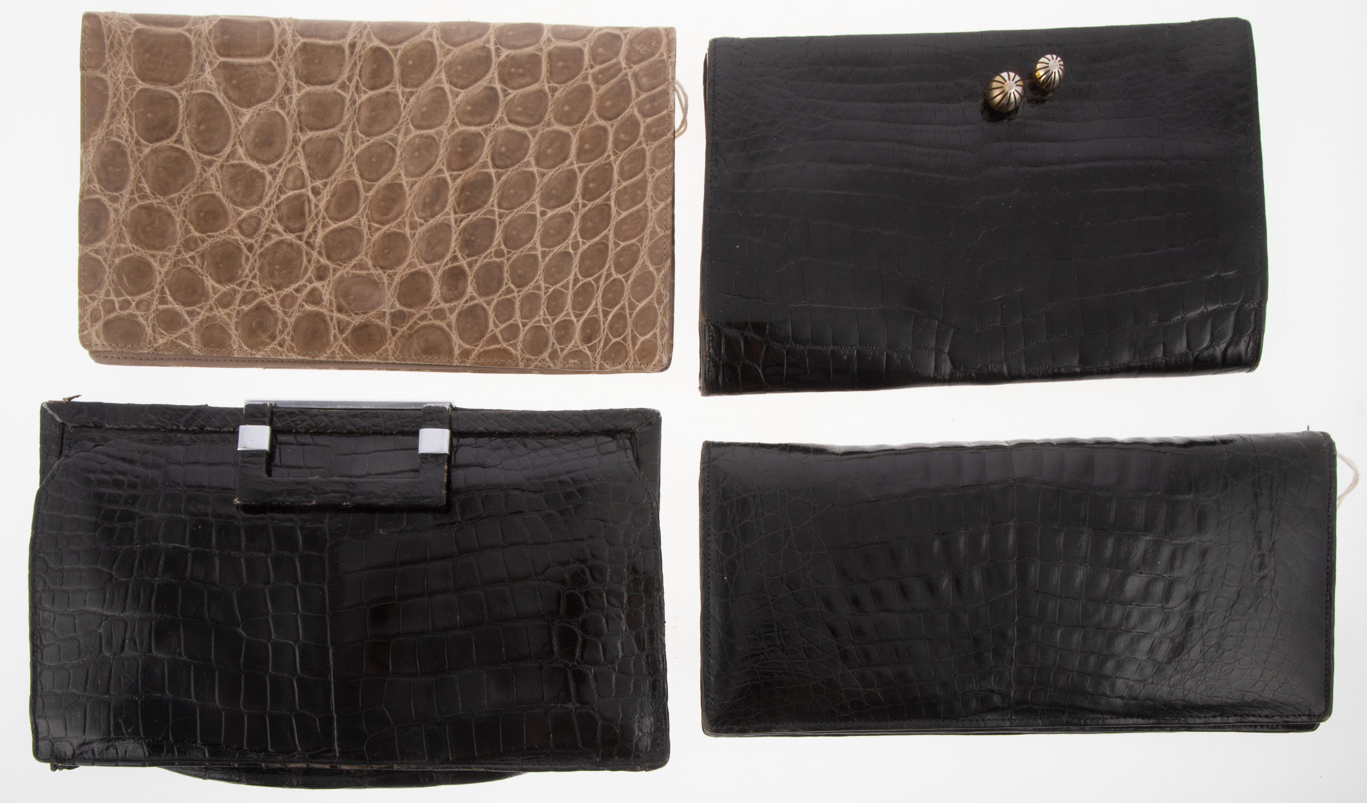 Appraisal: FOUR EXOTIC SKIN CLUTCHES including three black alligator and a