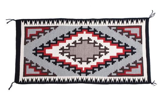 Appraisal: NAVAJO RUG Twentieth century Central hooked and stepped diamond motif