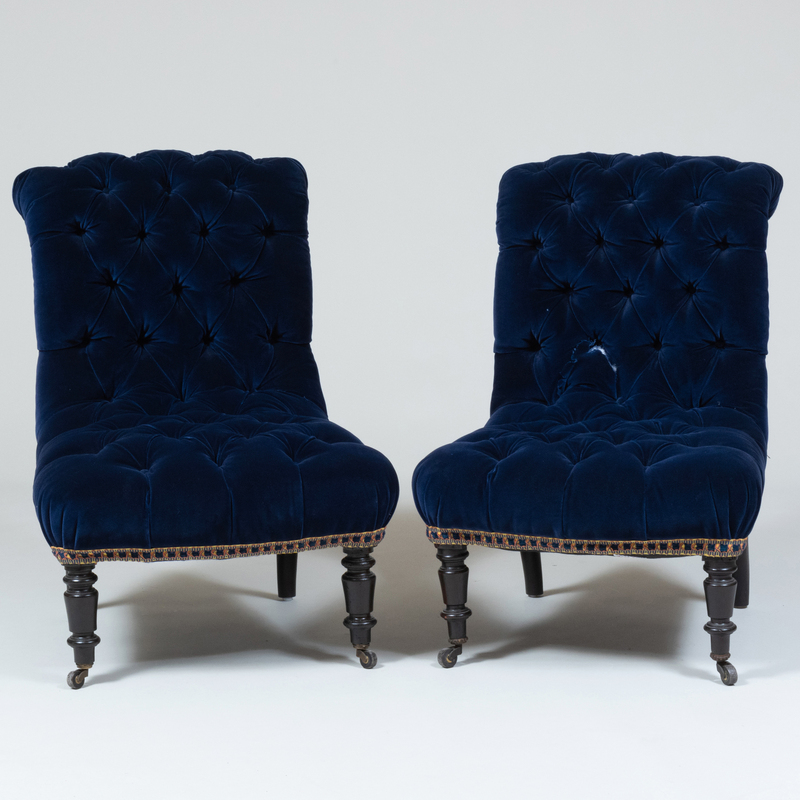 Appraisal: Pair of Victorian Ebonized and Blue Velvet Tufted Slipper Chairs