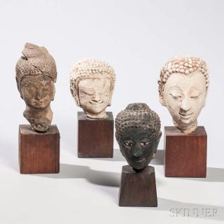 Appraisal: Four Fragmentary Buddhist Heads Four Fragmentary Buddhist Heads Southeast Asia