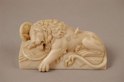 Appraisal: A carved ivory model of the Lion of Lucerne after