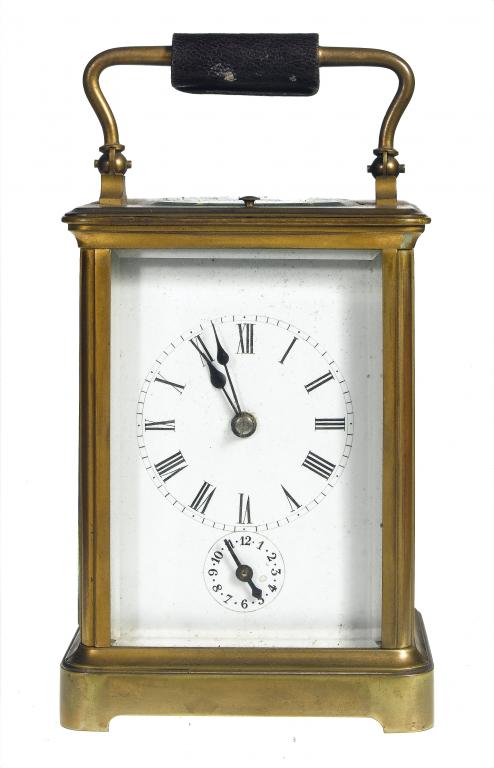 Appraisal: A FRENCH BRASS CARRIAGE CLOCK the enamelled mask dial with