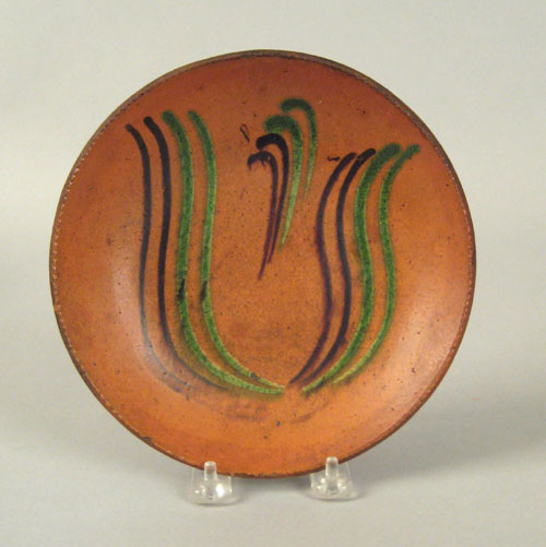 Appraisal: Pennsylvania redware pie plate th c with green and brown