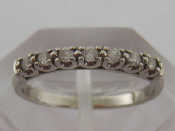 Appraisal: A platinum and diamond half eternity ring the seven brilliants