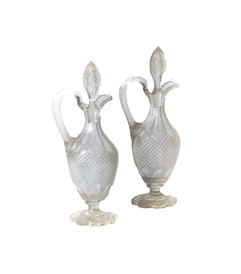 Appraisal: A pair of Victorian glass ewers and stoppers with hobnail