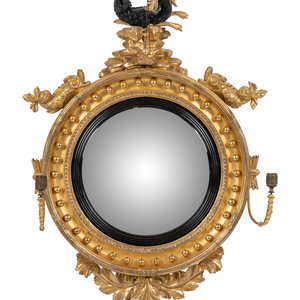 Appraisal: A Regency Parcel Ebonized Giltwood Convex Girandole Mirror Circa with