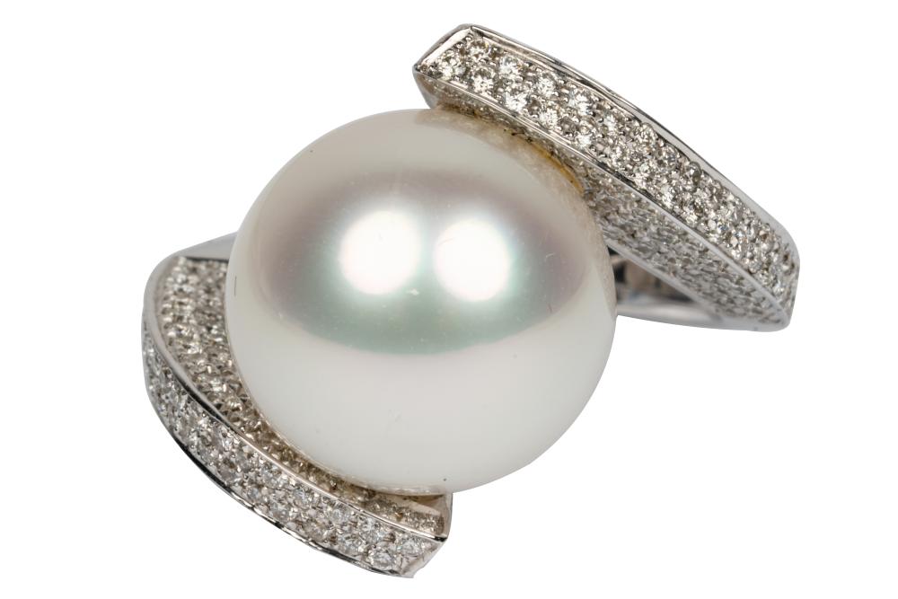 Appraisal: KARAT WHITE GOLD DIAMOND PEARL BYPASS RINGcentering one spherical drilled