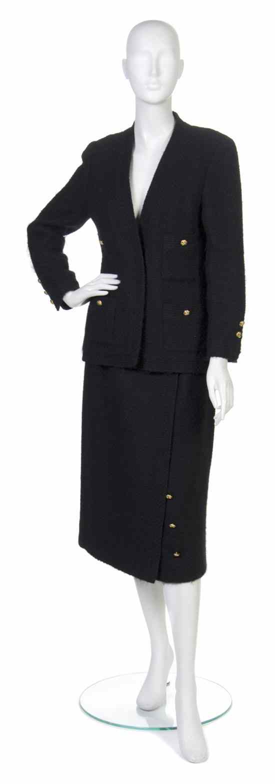 Appraisal: A Chanel Black Wool Skirt Suit goldtone buttons in a