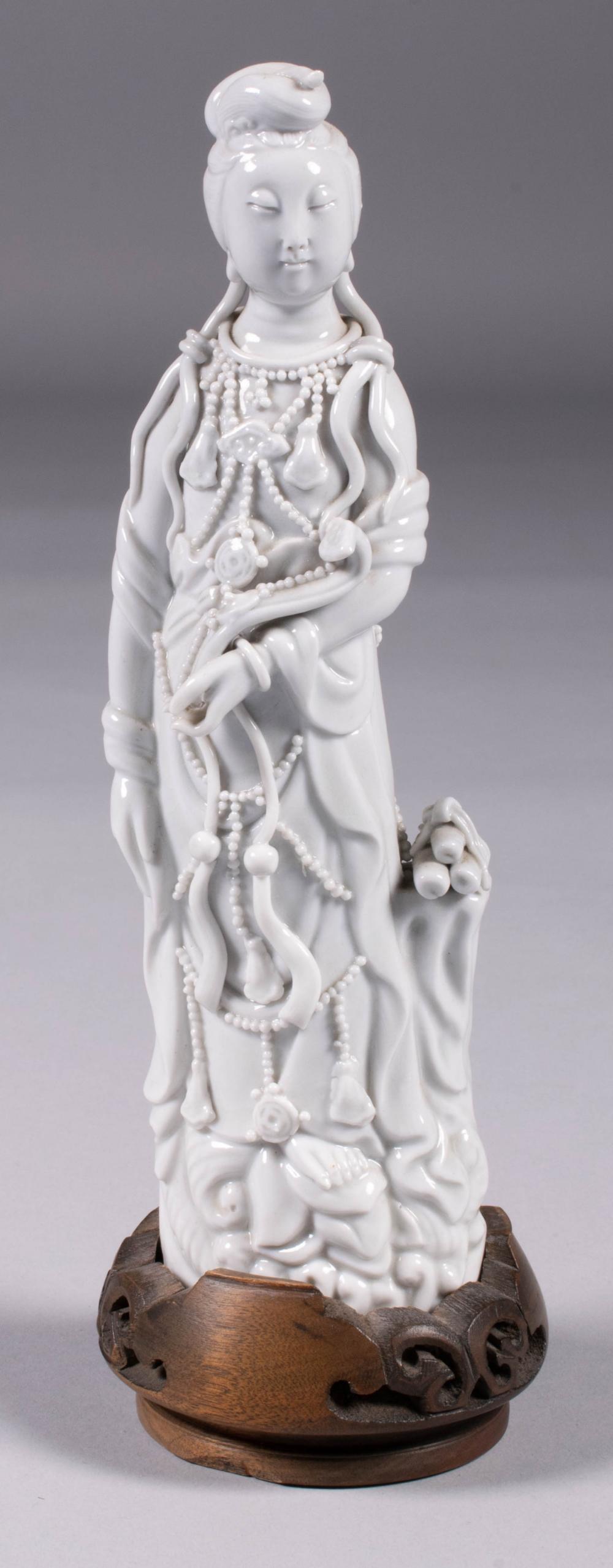 Appraisal: CHINESE BLANC-DE-CHINE FIGURE OF GUANYIN the standing deity dressed in