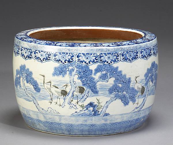 Appraisal: A large blue-and-white porcelain hibachi The wide circular body painted