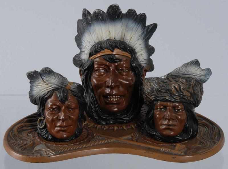 Appraisal: Cast Iron -Piece Indian Cigar Smoking Set Description Circa Smoking