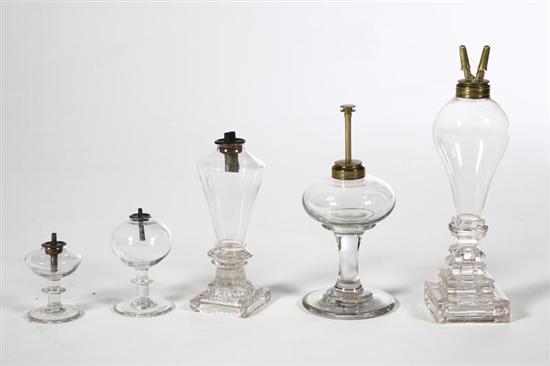 Appraisal: FIVE LAMPS American mid- th century blown and pressed glass