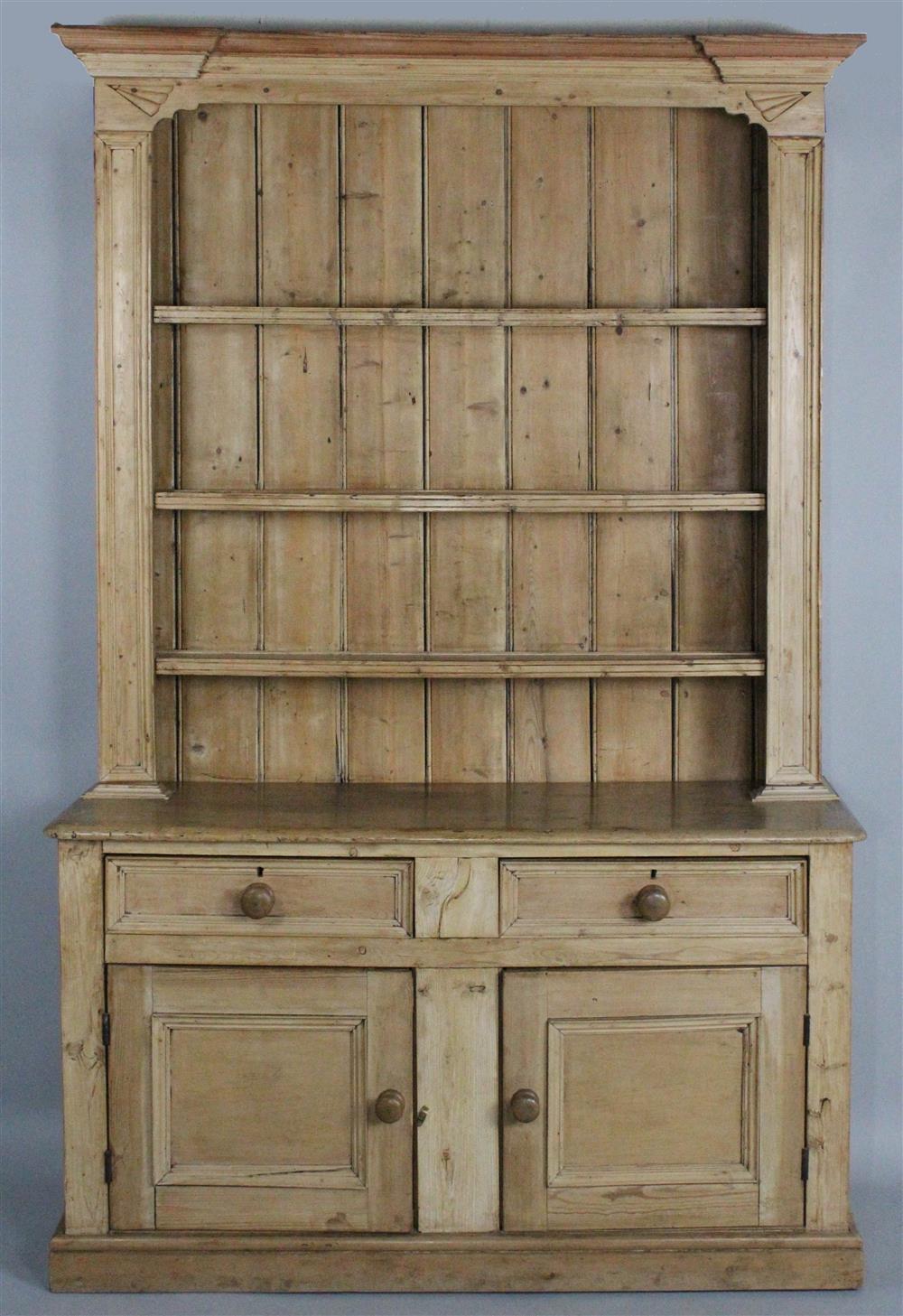 Appraisal: ENGLISH STRIPPED PINE STEP BACK CUPBOARD IN TWO PARTS the