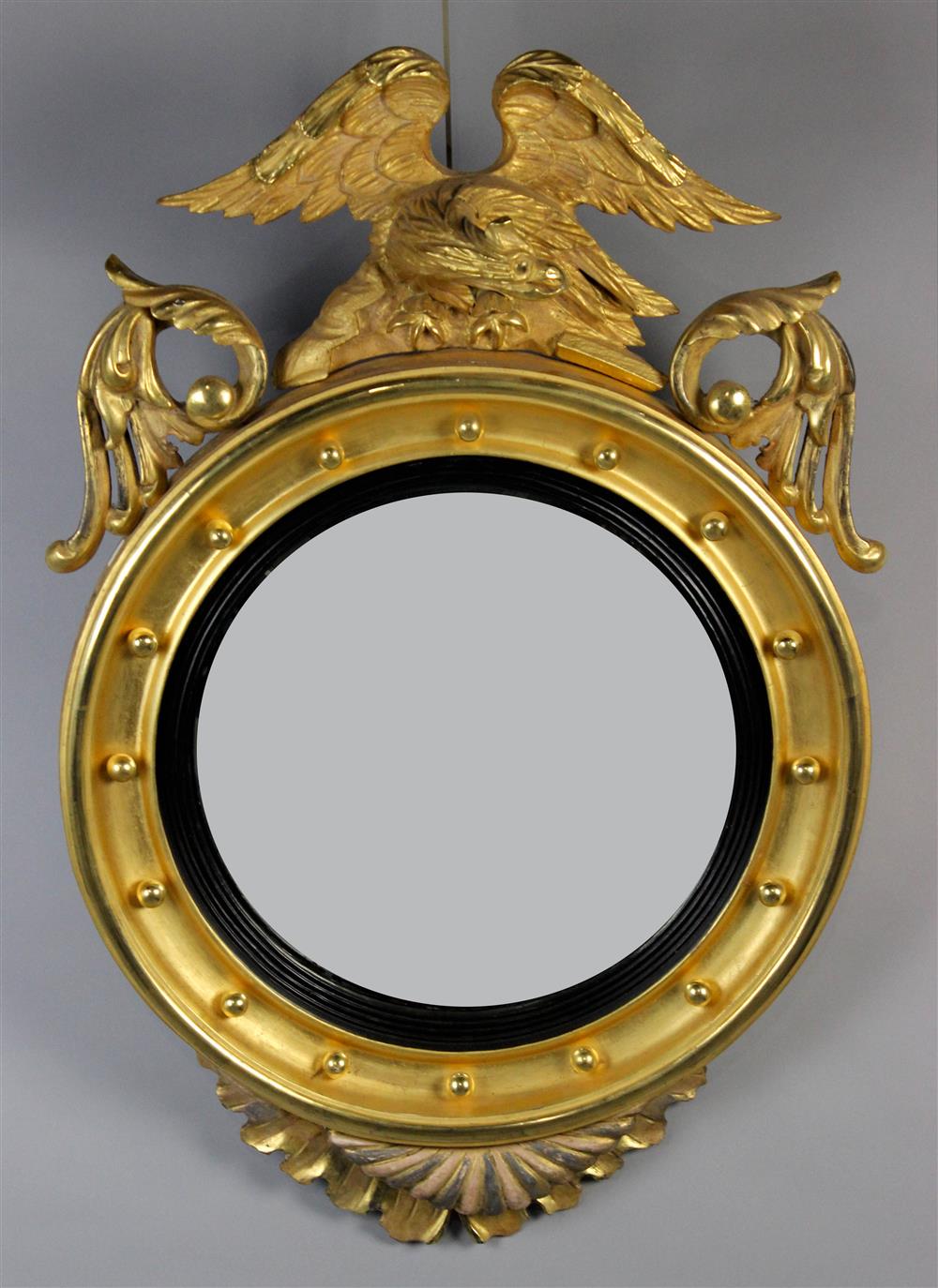 Appraisal: FEDERAL STYLE PARCEL EBONIZED GILTWOOD CONVEX MIRROR having an eagle