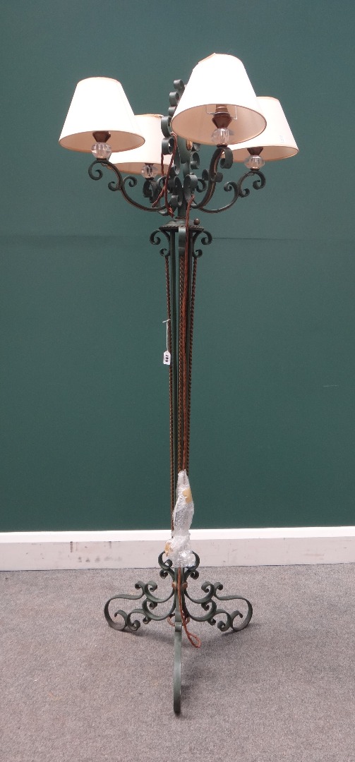 Appraisal: A green painted four branch wrought iron standard lamp th