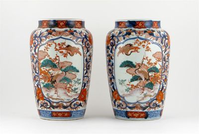 Appraisal: A pair of Japanese Imari cylindrical vases painted with panels