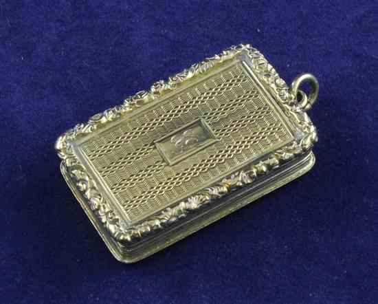 Appraisal: A George IV engine turned silver gilt rectangular vinaigrette by