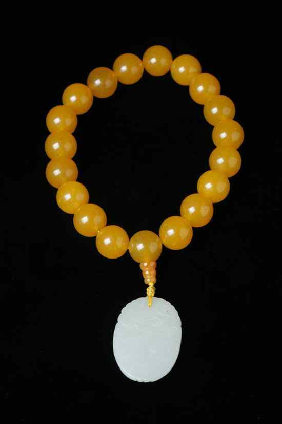 Appraisal: CHINESE YELLOW SOAPSTONE PRAYING BEAD FO ZHU With celadon jade