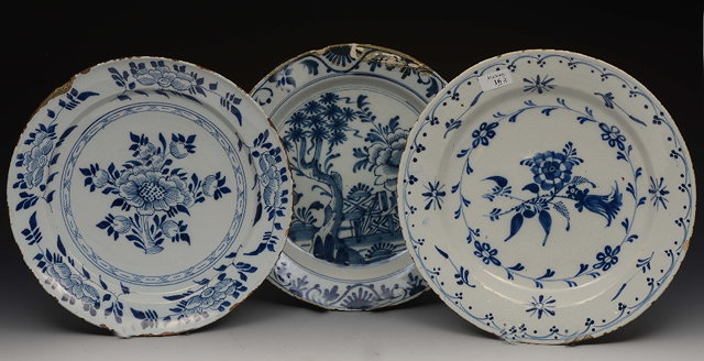 Appraisal: A GROUP OF THREE DUTCH DELFT BLUE AND WHITE PLATES