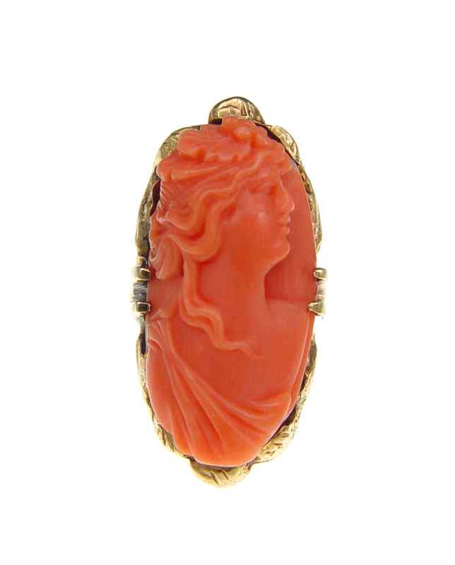 Appraisal: CARVED CORAL CAMEO RING K yellow gold ring contains one