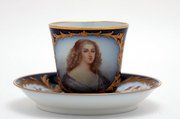 Appraisal: th century Sevres portrait cup and saucer blue ground with